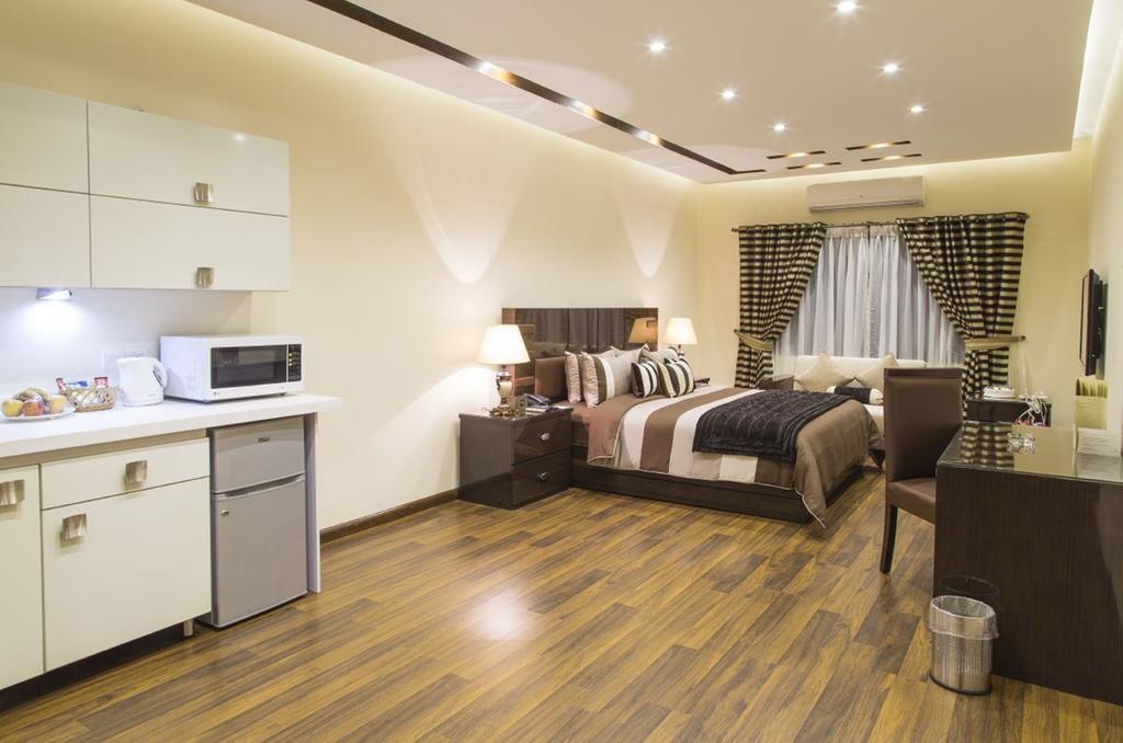Royaute Luxury Suites And Hotel Gulberg Lahore Kamer foto
